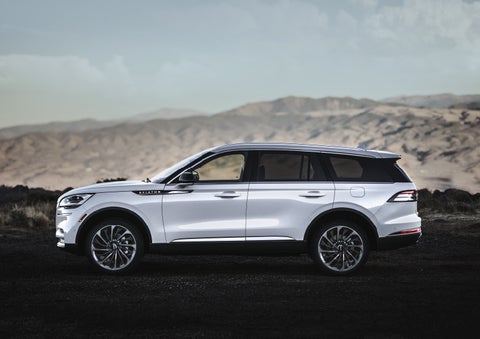 A Lincoln Aviator® SUV is parked on a scenic mountain overlook | Lincoln of Cutler Bay in Miami FL
