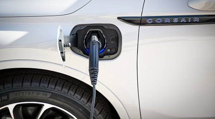 An electric charger is shown plugged into the charging port of a Lincoln Corsair® Grand Touring
model. | Lincoln of Cutler Bay in Miami FL