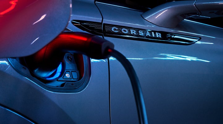A charger plugged into the charging port of a 2024 Lincoln Corsair® Plug-in Hybrid model. | Lincoln of Cutler Bay in Miami FL