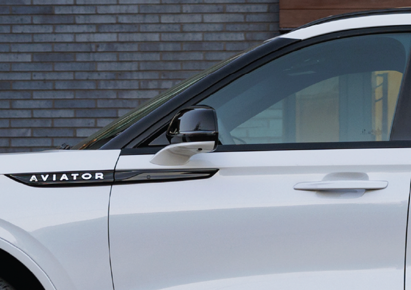 The driver’s door of a white 2025 Lincoln Aviator® SUV is showcased. | Lincoln of Cutler Bay in Miami FL