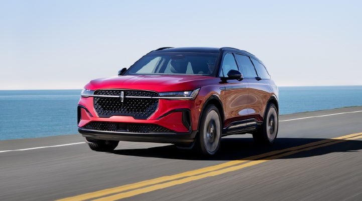 A 2025 Lincoln Nautilus® SUV is being driven on a seaside roadway. | Lincoln of Cutler Bay in Miami FL